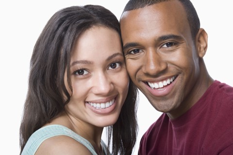 Studio portrait of young couple. Photo : Rob Lewine
