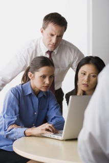 Three people working in office. Photo: Rob Lewine