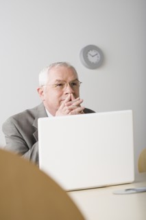 Portrait of mature businessman contemplating. Photo : Rob Lewine