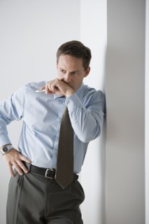 Portrait of businessman standing. Photo : Rob Lewine