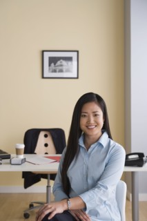 Portrait of businesswoman in office. Photo : Rob Lewine