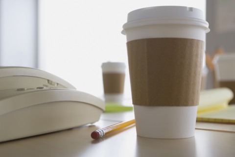Plastic coffee cup on desk. Photo: Rob Lewine