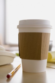 Plastic coffee cup on desk. Photo: Rob Lewine