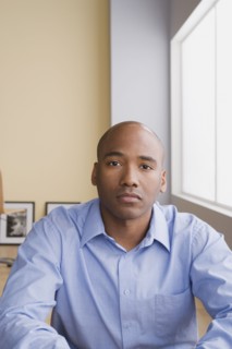 Portrait of mid adult businessman. Photo : Rob Lewine