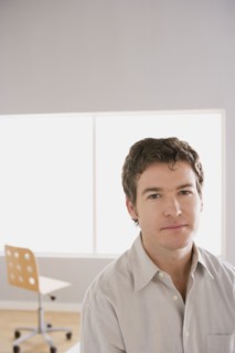 Portrait of young businessman. Photo : Rob Lewine