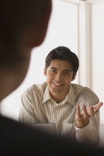 Two businessmen in meeting. Photo : Rob Lewine