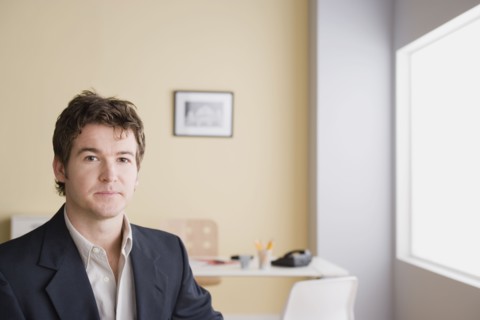 Portrait of young businessman. Photo : Rob Lewine