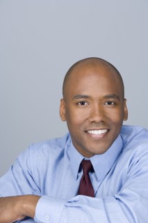 Portrait of happy mid adult businessman. Photo : Rob Lewine