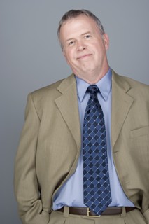 Portrait of happy mature businessman. Photo : Rob Lewine