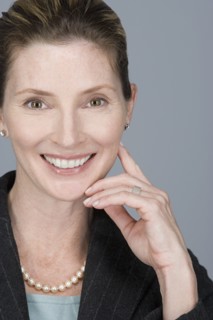Portrait of happy mature businesswoman. Photo: Rob Lewine