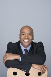 Portrait of happy mid adult businessman. Photo : Rob Lewine