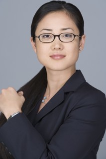 Portrait of cheerful businesswoman. Photo : Rob Lewine