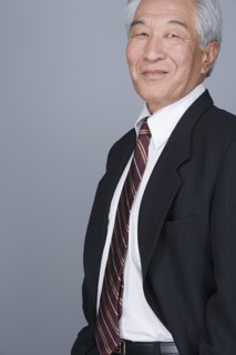 Portrait of happy senior businessman. Photo : Rob Lewine