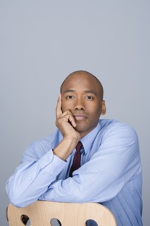 Portrait of happy mid adult businessman. Photo : Rob Lewine