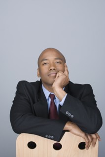 Portrait of happy mid adult businessman. Photo : Rob Lewine