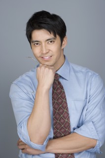 Portrait of happy young businessman. Photo : Rob Lewine