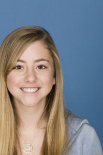 Portrait of happy teenage (14-15). Photo : Rob Lewine