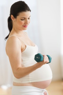 Portrait of pregnant woman exercising.