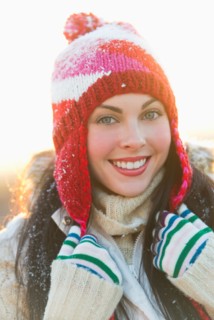 Portrait of young woman wearing knit hat.
