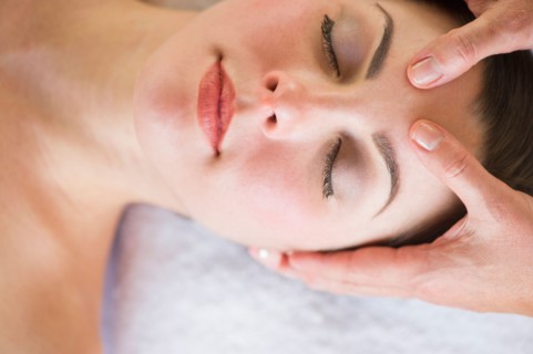 Woman receiving face massage.
