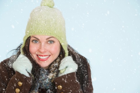 Studio portrait of woman in winter clothing.