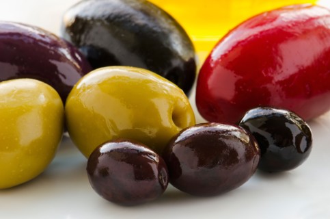 Close-up of various olives, studio shot.