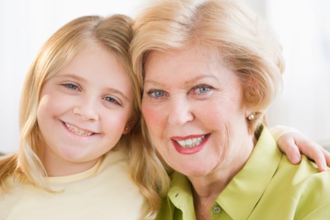 Portrait of grandmother with granddaughter (8-9).