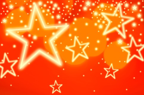 Stars on orange background, studio shot.