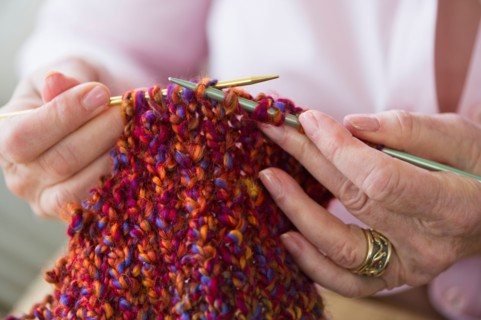 Senior woman knitting, close-up.