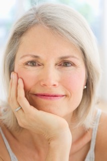 Portrait of smiling senior woman .