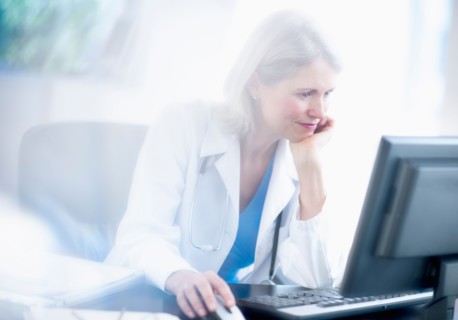 Senior female doctor working in her office.