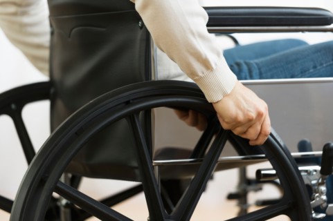 Man on wheelchair.