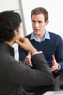 Two businessmen in discussion.