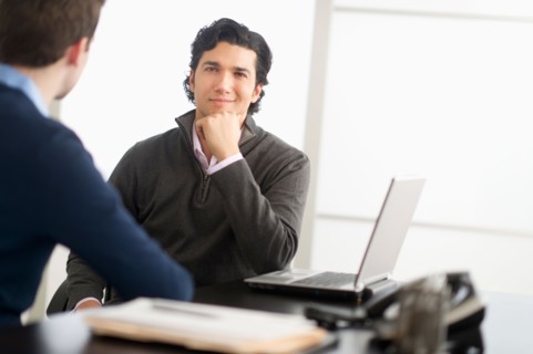 Two businessmen in discussion.