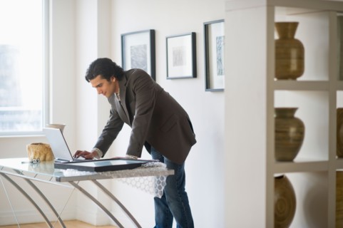 Man working in his art gallery.