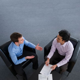 Two businessman talking.