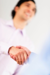 Two businessman shaking hands.