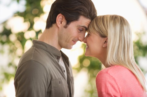 Couple rubbing with noses.