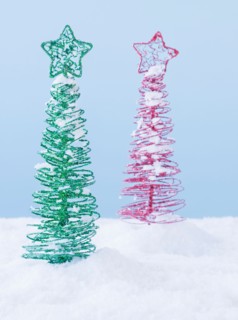 Studio shot of artificial Christmas trees. Photo : Daniel Grill