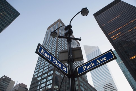 USA, New York State, New York City, low angle view of street name sign in front of building