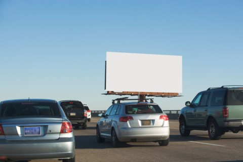 Traffic and blank billboard. Photo : fotog