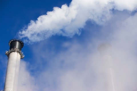 part of chimneys coverred by smoke. Photo : fotog