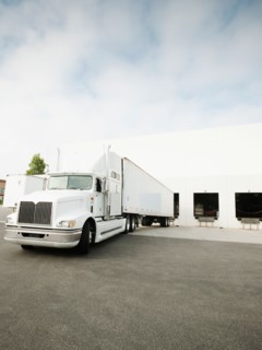 Truck loading in warehouse.