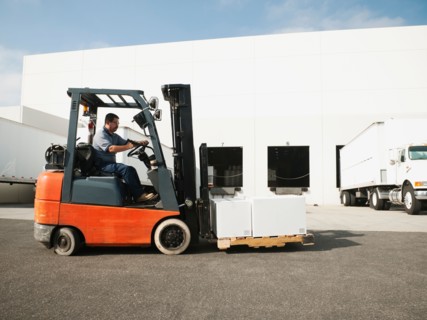 Man driving forklift.