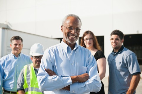Portrait of warehouse workers and manager.