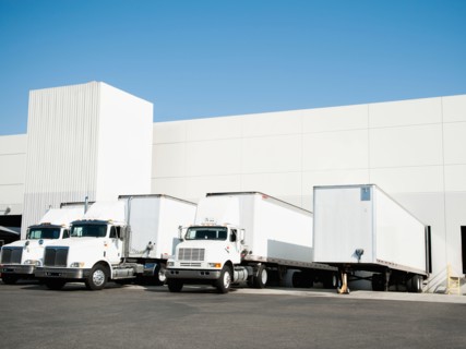 Trucks and warehouse.