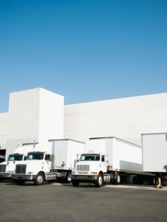 Trucks and warehouse.