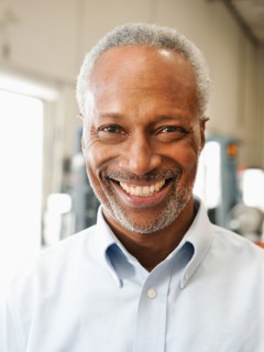 Portrait of businessman in warehouse.