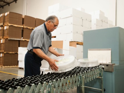 Warehouse worker assembling merchandise.