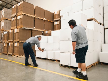 Warehouse workers scanning delivery.